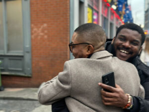 A picture of two of our student and CEO hugging each other at our meet and greet event at Birmingham City UK 