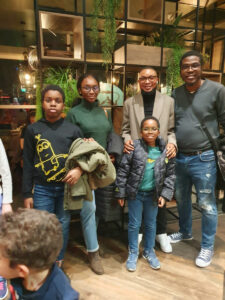 A picture of two of our student and her family with the CEO at our meet and greet event at Birmingham City UK 
