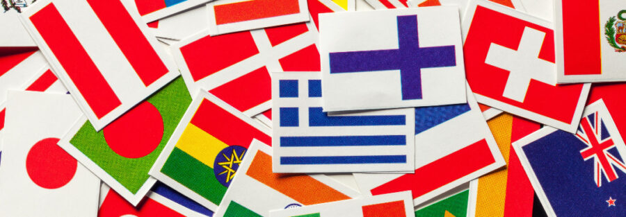 A picture with multiple flags that reads, '7 Factors to Consider when choosing a country for your studies abroad'
