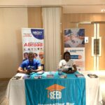 A Picture that shows 2 of Negxy Staff at the SEED Business School Festival in Lagos 